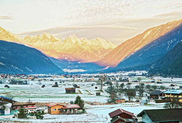 istock View on countryside in snow covered Switzerland at sunset 509053980