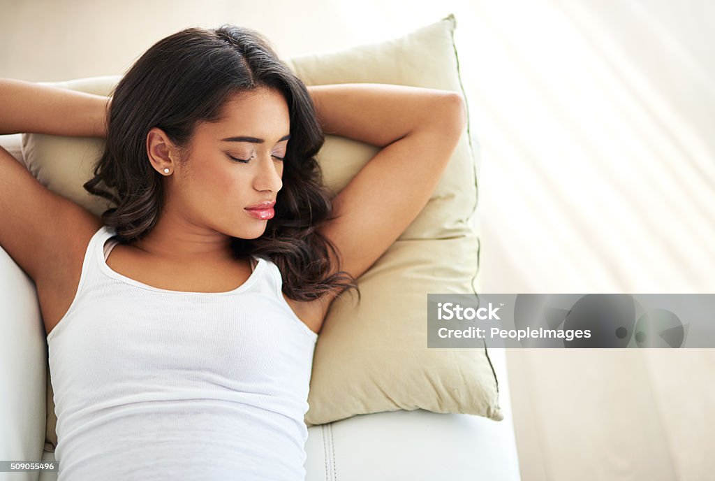 All you need is sleep Shot of a young woman asleep on her sofahttp://195.154.178.81/DATA/i_collage/pi/shoots/806332.jpg 20-29 Years Stock Photo