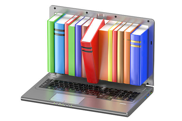 istock Laptop and stack of color books 509055776