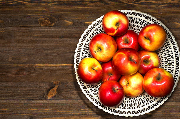 istock fresh apples on a wooden table in the background 509055952