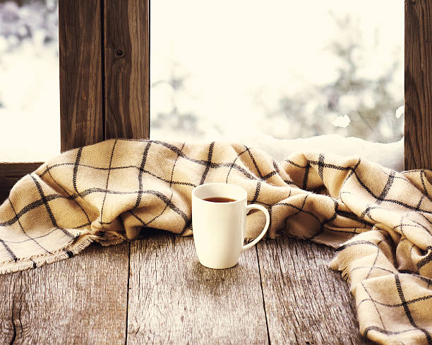 istock White cup of coffee on stylized wooden window sill. 509056182