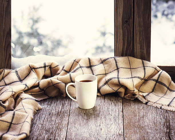 istock White cup of coffee stylized wooden window sill. 509056596