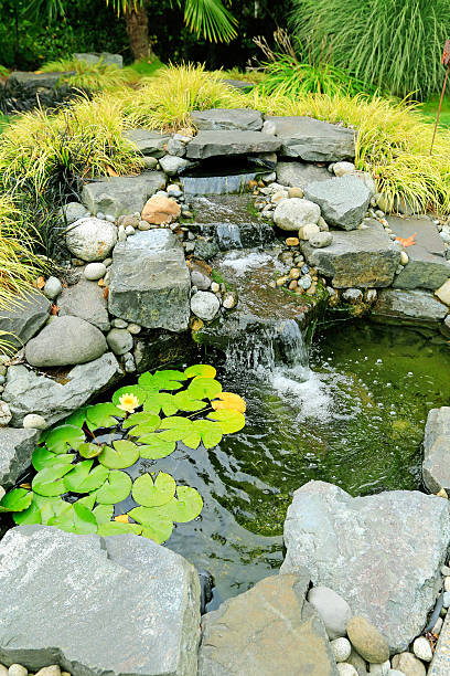 istock Waterfall for summer garden. Landscape design idea 509077095