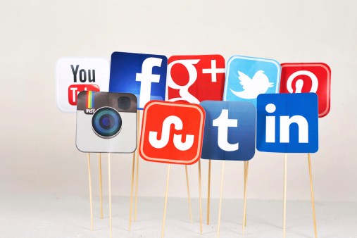 Sakarya, Turkey - August 20, 2014: A collection of well-known social media brands printed on paper and placed on stick. Facebook, YouTube, Twitter, Google Plus, Instagram, Tumblr, Linkedin, Stumbleupon, Pinterest logos.