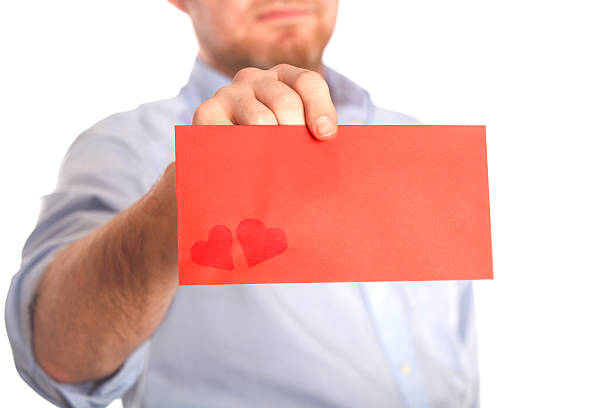 istock Man holds love letter 509080359