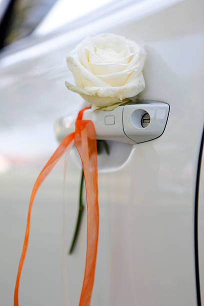 Floral wedding decoration on car