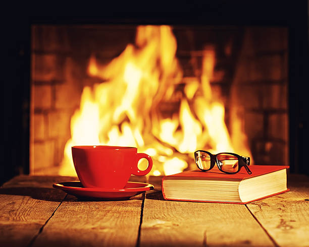 istock Red cup of coffee or tea, glasses and old book 509089478