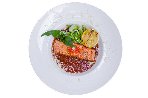istock Salmon in red tomato sauce with caviar, isolated 509089650