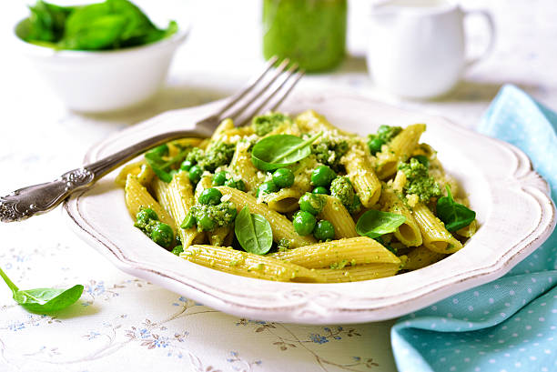 Penne with spinach pesto and green pea.