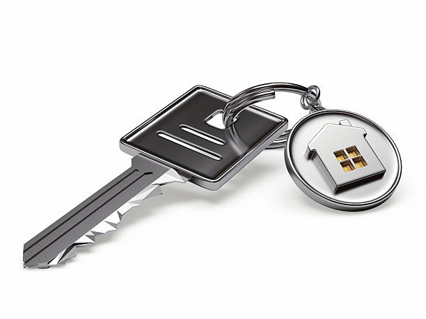 istock Silver key and round keyc hain with house 509093546