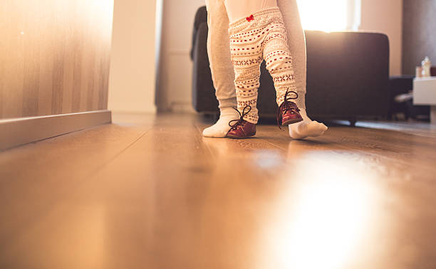 Mother and baby legs. First steps.