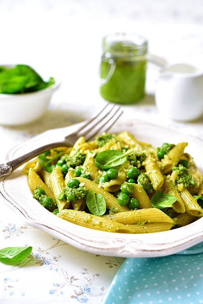 istock Penne with spinach pesto and green pea. 509093606