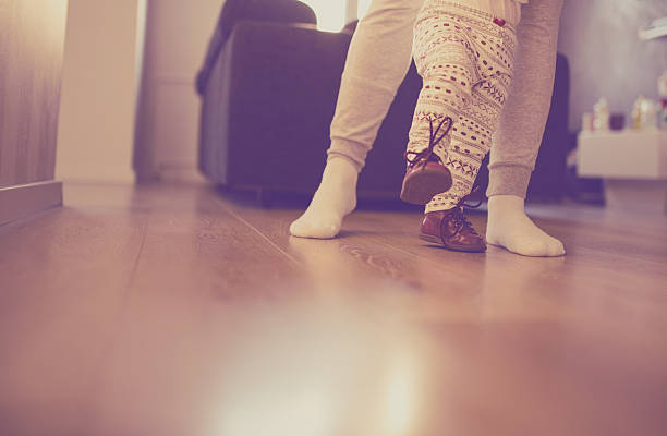 istock Mother and baby legs. First steps. 509093672