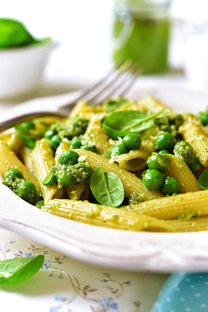 istock Penne with spinach pesto and green pea. 509093934