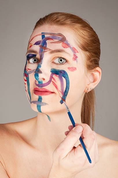 istock Messthetics - Woman Painting Her Face 509094048