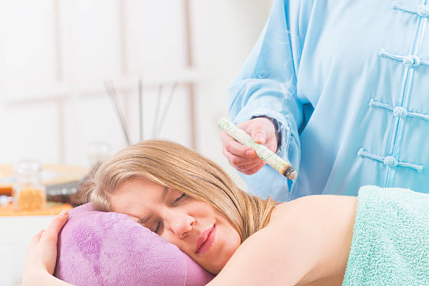 istock Alternative medicine therapist doing moxa treatment 509095364