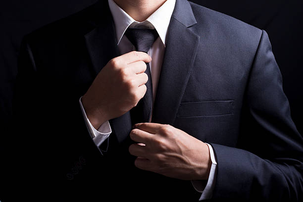 istock Businessman Adjust Necktie his Suit 509095936