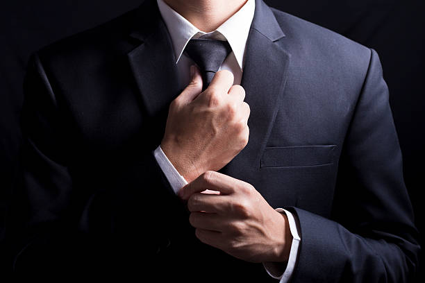 istock Businessman Adjust Necktie his Suit 509096064