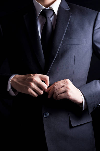 istock Businessman in Suit on Isolated Black Background 509096776