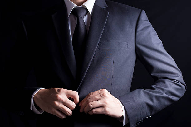 istock Businessman in Suit on Isolated Black Background 509096884