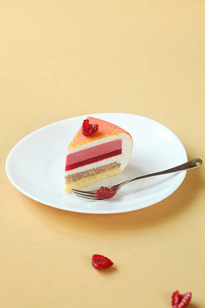 istock Piece of Layered Vanilla, Raspberry, Peach Mousse Cake, 509097426
