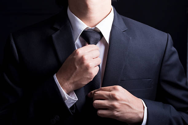 istock Businessman Adjust Necktie his Suit 509098432