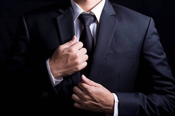 istock Businessman in Suit on Isolated Black Background 509098592
