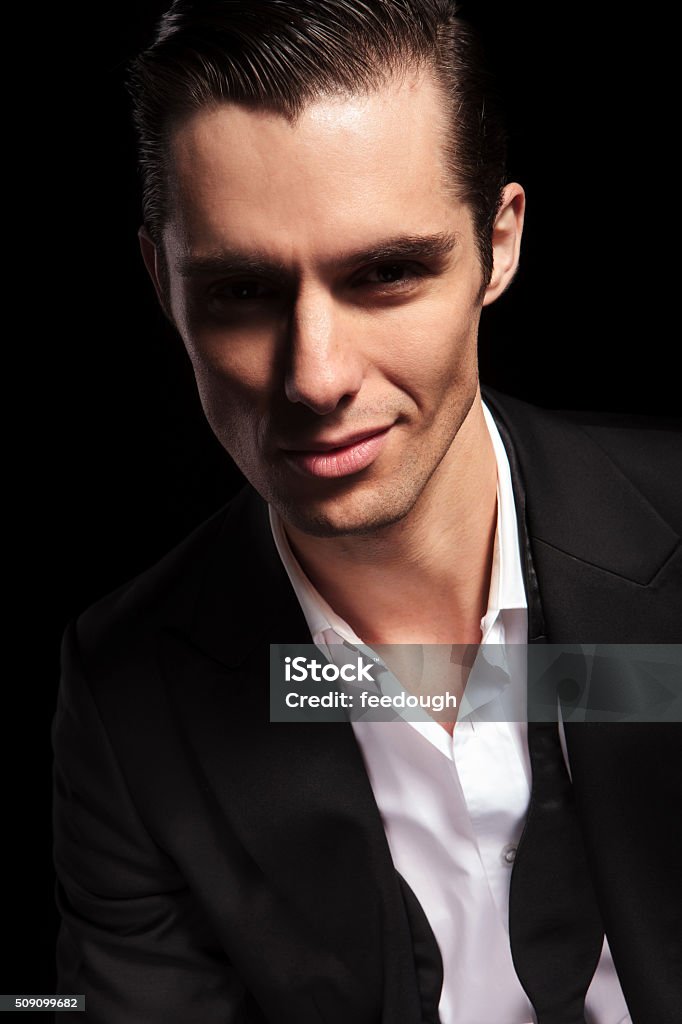 Businessman With Open Shirt Smiling In Studio Stock Photo - Download ...