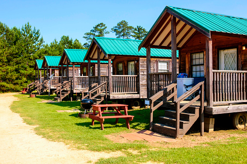 Hattiesburg, MS, USA - June 6, 2015: Vacation wood cabins on a RV park near Hattiesburg, Mississippi