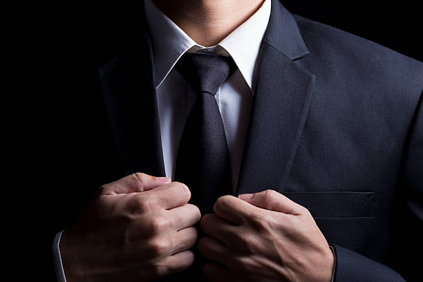 istock Businessman in Suit on Isolated Black Background 509100378