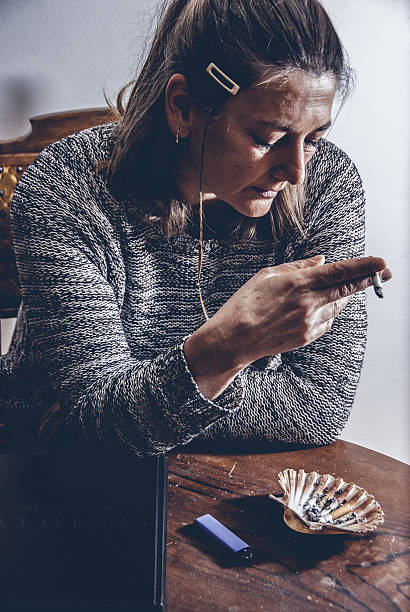 istock Woman Enjoying a Cigarette Indoors 509101276