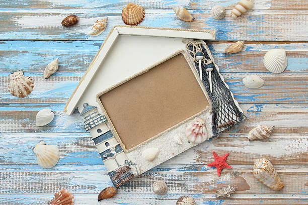 istock Lighthouse photo frame on wooden background 509102166