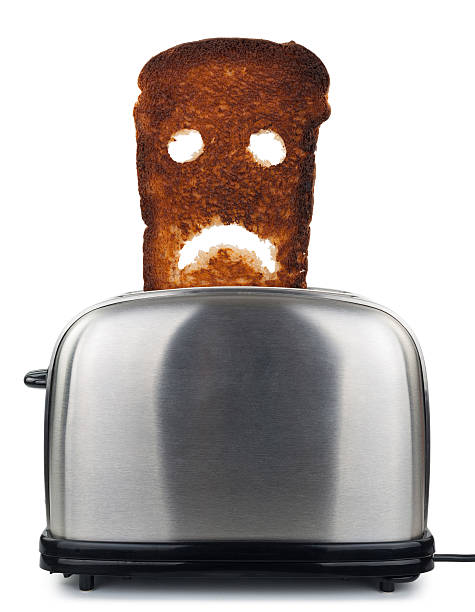 istock Burnt toast bread  in a toaster 509102204