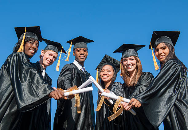 istock Graduates Holding Their Diplomas 509105350
