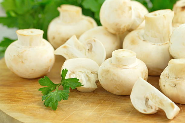 istock Raw mushrooms with greens 509107508
