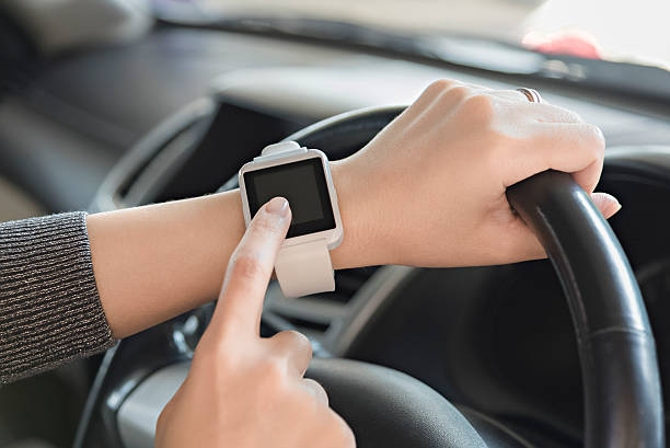 istock Woman uses smartwatch in the car. 509109056