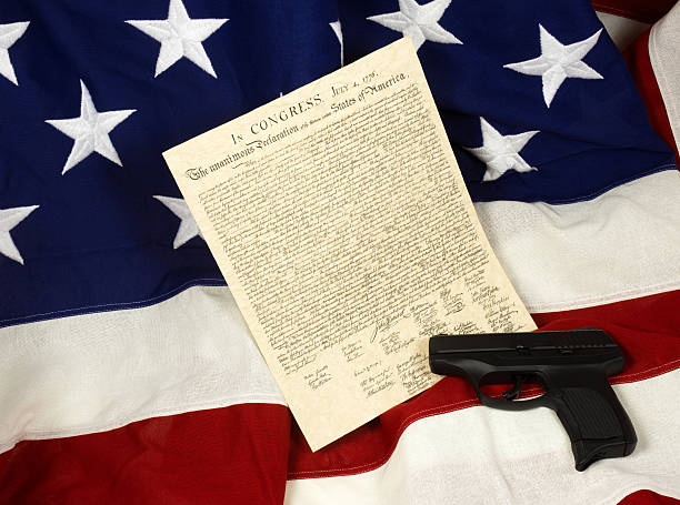 istock Declaration of Independence with Hand Gun on Flag, Horizontal 509109110