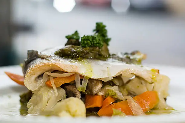 Photo of Sea bass with mixed seasonal vegetables on plate