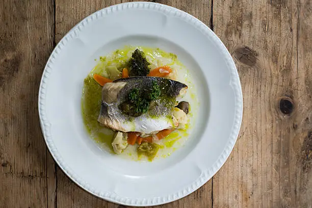 Photo of Sea bass with mixed seasonal vegetables from above