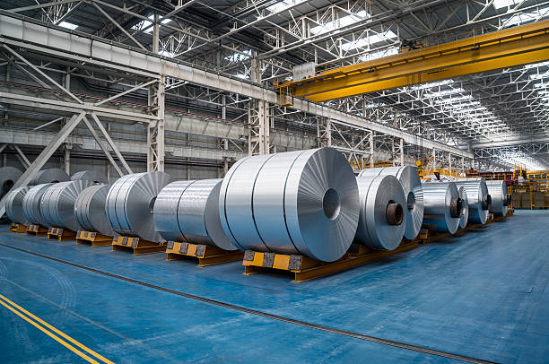 Large Aluminium Steel Rolls Large Aluminum Steel Rolls in the factory. Image taken in daylight with a Sony A7Rii (42 megapixels) and developed from raw..  metal industry photos stock pictures, royalty-free photos & images