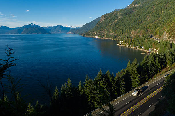istock Dump truck driving along Highway 99, BC, Canada 509111504