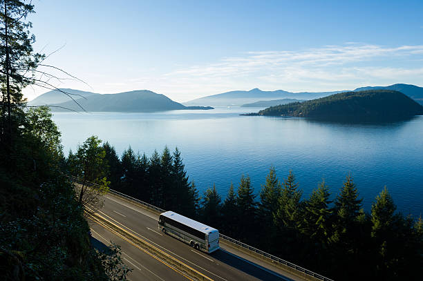 Bus driving the Sea to Sky Highway, BC stock photo