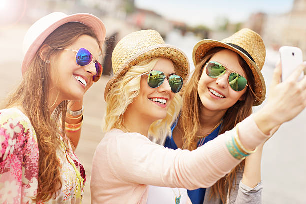 istock Three friends taking selfie in the city 509111838