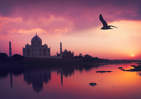 Taj Mahal and the Yamuna River by sunset in Agra, Uttar Pradesh, India