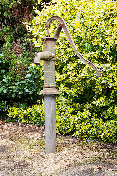 istock old cast iron water pump in garden 509113121