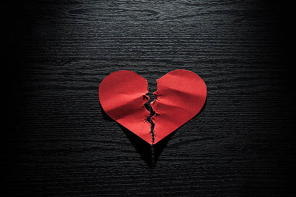 istock red hearts crumpled paper on dark wood background 509115008