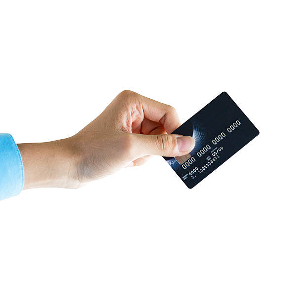 istock Closeup hand holding credit card isolated over white backgroud 509115439