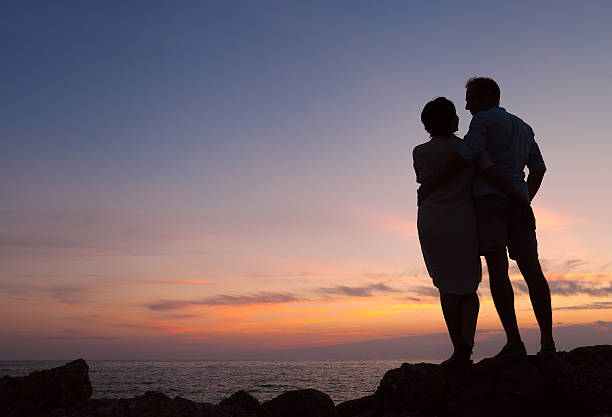 istock Loving couple sunset silhouette 509115716