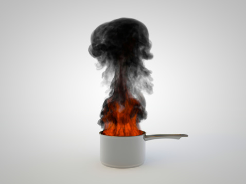 rendered illustration of a pan overheated and in flameson white background