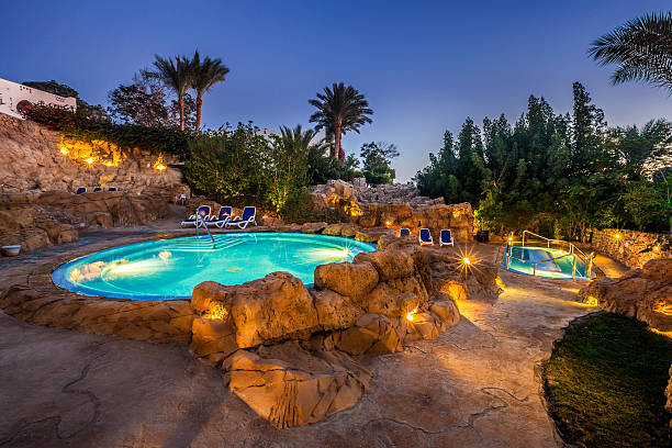 istock Evening view for luxury swimming pool in night illumination 509116840